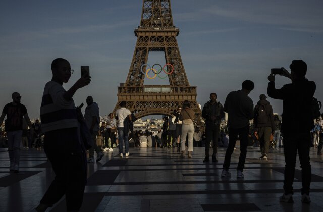 The Olympic rings are seen on the Eiffel Tower on Friday, June 7, 2024 in Paris.  Paris Olympics organizers placed the rings on the Eiffel Tower on Friday as the French capital marks 50 days until the start of the Summer Games.  The 95-foot-long, 43-meter-high five-ring structure, made entirely of recycled French steel, will appear on the south side of the 135-year-old landmark in central Paris, overlooking the Seine River.  (AP Photo/Aurelien Morissard)